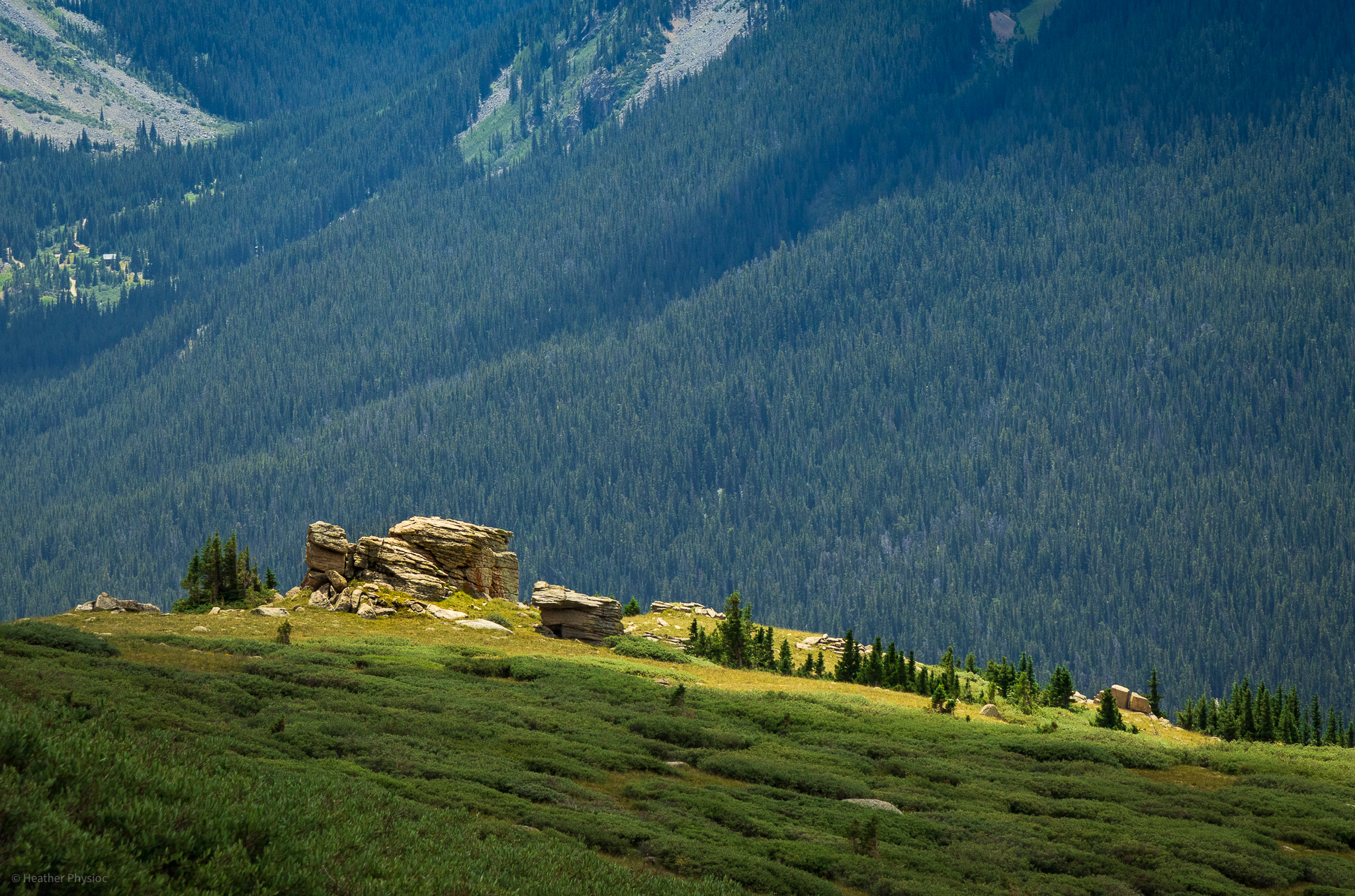 Rock Outcropping Spotlighted by Break in the Clouds on Lenawee Trail near Peru Creek, Colorado