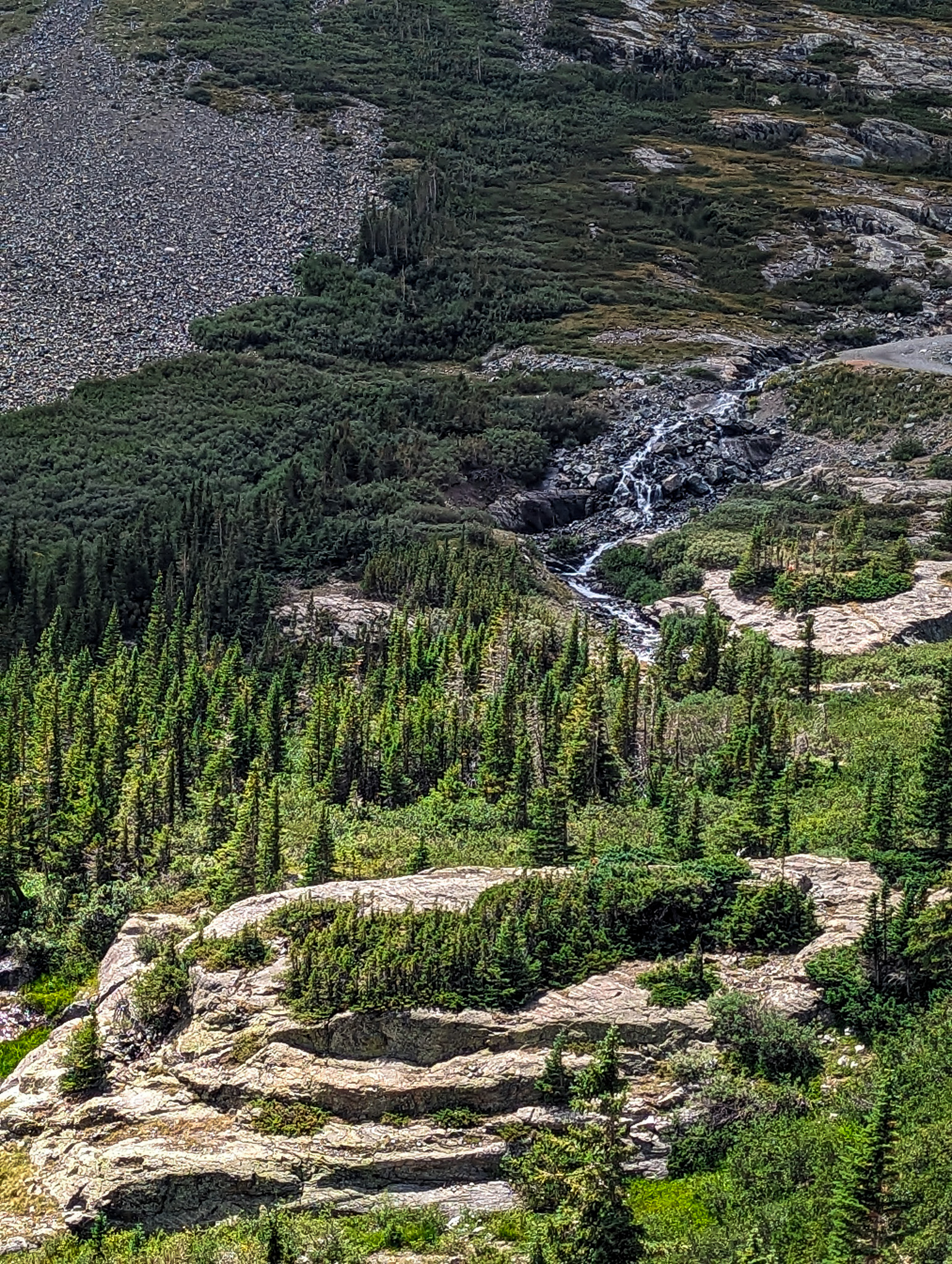White Falls behind an unusual rock outcropping on the McCullough Gulch Trail near Breckenridge, Colorado