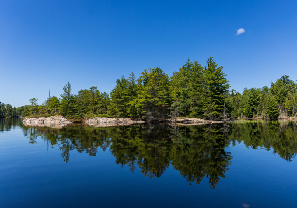 Island of Trees & Cloud Reflected on Rainy Lake in Voyageurs National Park, Minnesota Island of Trees & Cloud Reflected on Rainy Lake in Voyageurs National Park, Minnesota